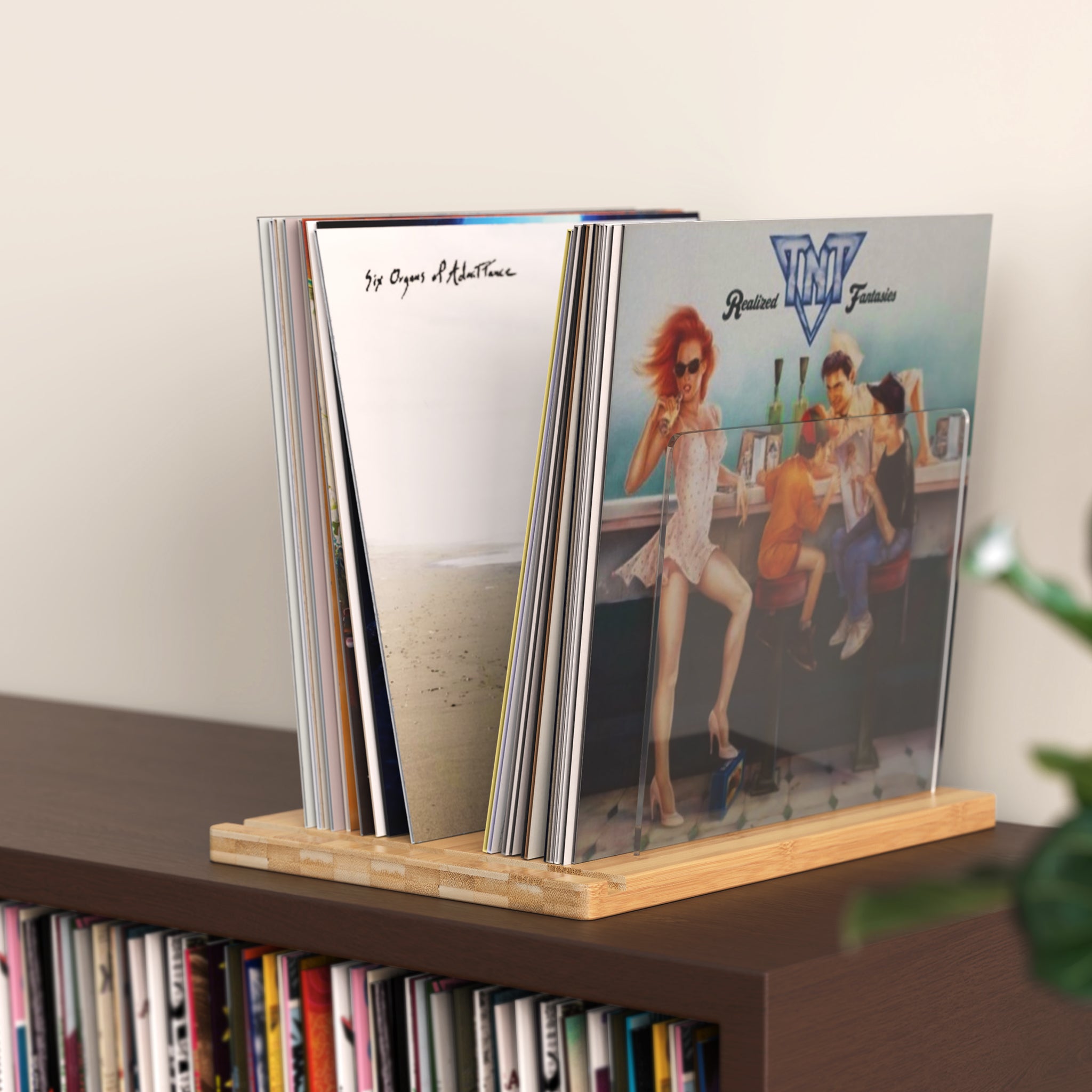 TAKMORK Record Storage Holder is made of high density transparent acrylic sheet with thick bamboo material，The vinyl records holder measures approximately 11 x 14.57 x 9.84 inches，enough to hold about 45 records without worrying about tipping.The simple yet elegant combination of natural wood and clear acrylic ensures it complements various home decoration styles. 