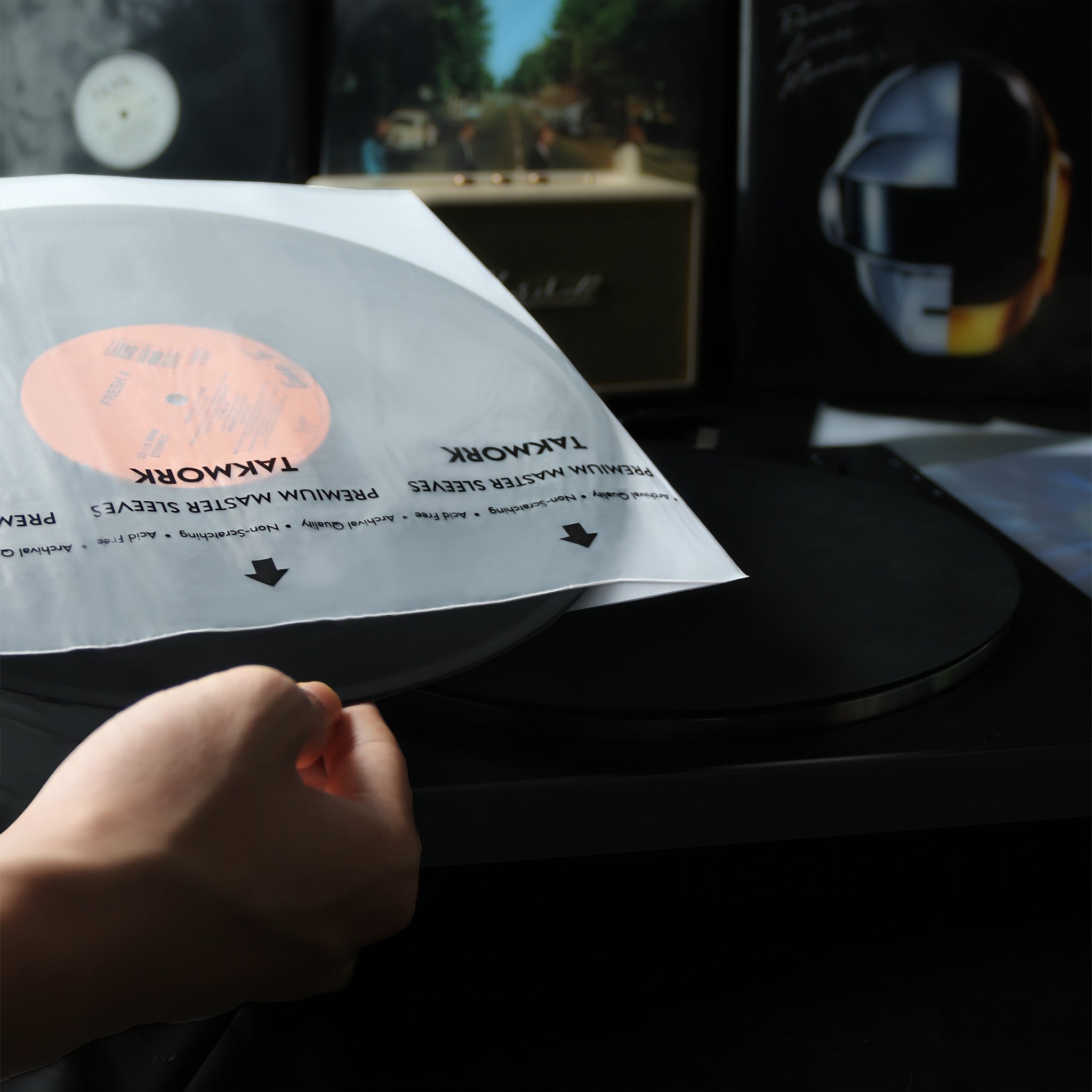 TAKMORK record inner sleeves are imported, three-ply, premium anti-static (rice paper-like) sleeves that work with both LPs and laser discs. The back construction consists of a paper layer sandwiched between two sheets of high density polyethylene (HDPE) with a clear HDPE front.